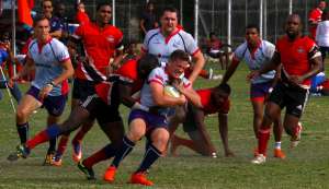 Bermuda’s Conor McGowen, centre, is tackled by TT’s Jason Quashie in their RAN 15s Tournament clash recently at St Anthony’s Ground, Westmoorings. Bermuda’s Conor McGowen, centre, is tackled by TT’s Jason Quashie in their RAN 15s Tournament clash recently at St Anthony’s Ground, Westmoorings.