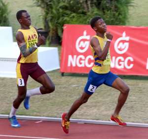 Mishak Peters, right, of Abilene Wildcats, wins the boys U17 800m final in a time of 2:03:54 secs, at the NGC/NAAA Jr Championships, Hasely Crawford Stadium, Port of Spain, yesterday. Mishak Peters, right, of Abilene Wildcats, wins the boys U17 800m final in a time of 2:03:54 secs, at the NGC/NAAA Jr Championships, Hasely Crawford Stadium, Port of Spain, yesterday.
