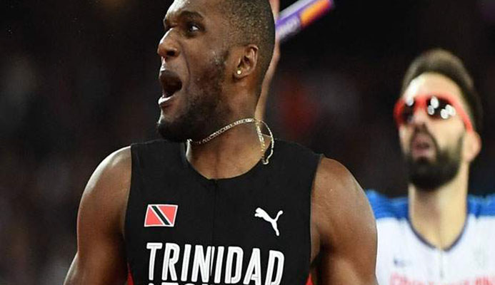SAVOURING THE MOMENT: Trinidad and Tobago’s Lalonde Gordon looks to the stands after completing victory in the men’s 4x400m final at the IAAF World Championships in London on Saturday. —Photo: AFP