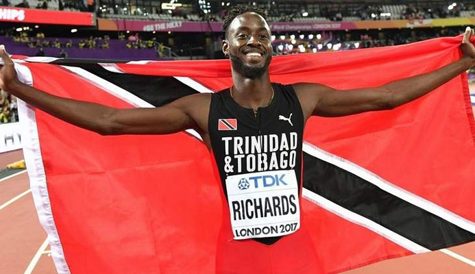 Trinidad and Tobago's Jereem Richards celebrates after winning third place in the final of the men's 200m event at the 2017 IAAF World Championships at the London Stadium in London on August 10, 2017. / AFP PHOTO / Andrej ISAKOVIC