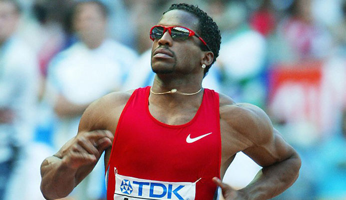 Ato Boldon of Trinidad and Tobago competes in heat ten of the men's 100m August 24, 2003 during the 9th IAAF World Athletics Championships at the Stade de France in Saint Denis, outside Paris. CREDIT: Getty Images