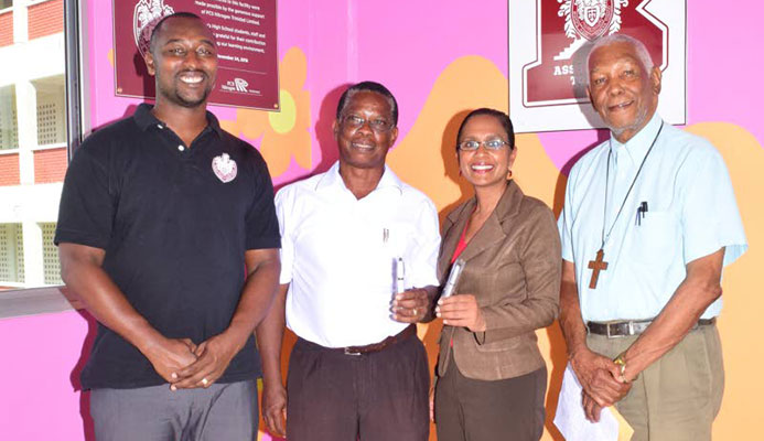 From left, football coach Richard Goddard, Project Chairman for the Bishops High School new sport field - Dr Alison Williams, Acting Principal Cindy Ramnarine and Chairman of the Board of Governors of the school, Archdeacon Kenneth Forrester, display pen drives that are on sale to help raise funds for the schools $4 million sports ground.