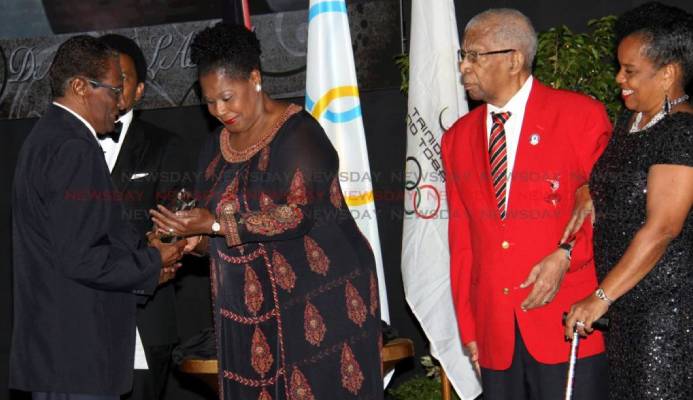 Veteran journalist Dave Lamy (left) receives the Alexander Chapman Award from President Paula-Mae Weekes, at the TTOC Awards, Hyatt, Port of Spain on December 29 2018. Behind them is TTOC president Brian Lewis. Also in photo is Alexander Chapman (second from right) and TTOC Secretary General, Annette Knott. PHOTO BY ANGELO MARCELLE. - Angelo Marcelle