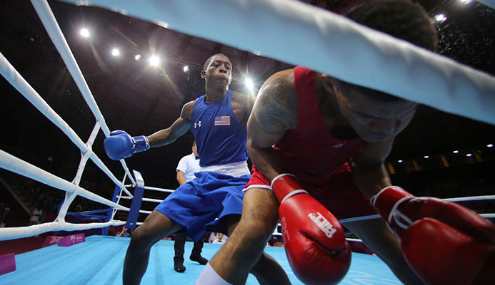 Keyshawn Davis of the US (left), throws a punch to Michael Alexzander of Trinidad and Tobago during the third round of their men’s welterweightg boxing semifinal match at the Pan American Games in Lima, Peru, on Tuesday. (AP PHOTO)