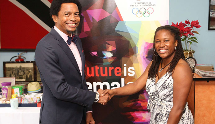 American Lauryn Williams, a four-time Olympian, with T&T Olympic Committee president Brian Lewis at Olympic House on Abercromby Street, Port-of-Spain, yesterday ahead of the three-time Olympic medallist’s discussion on her athletic career and life thereafter.