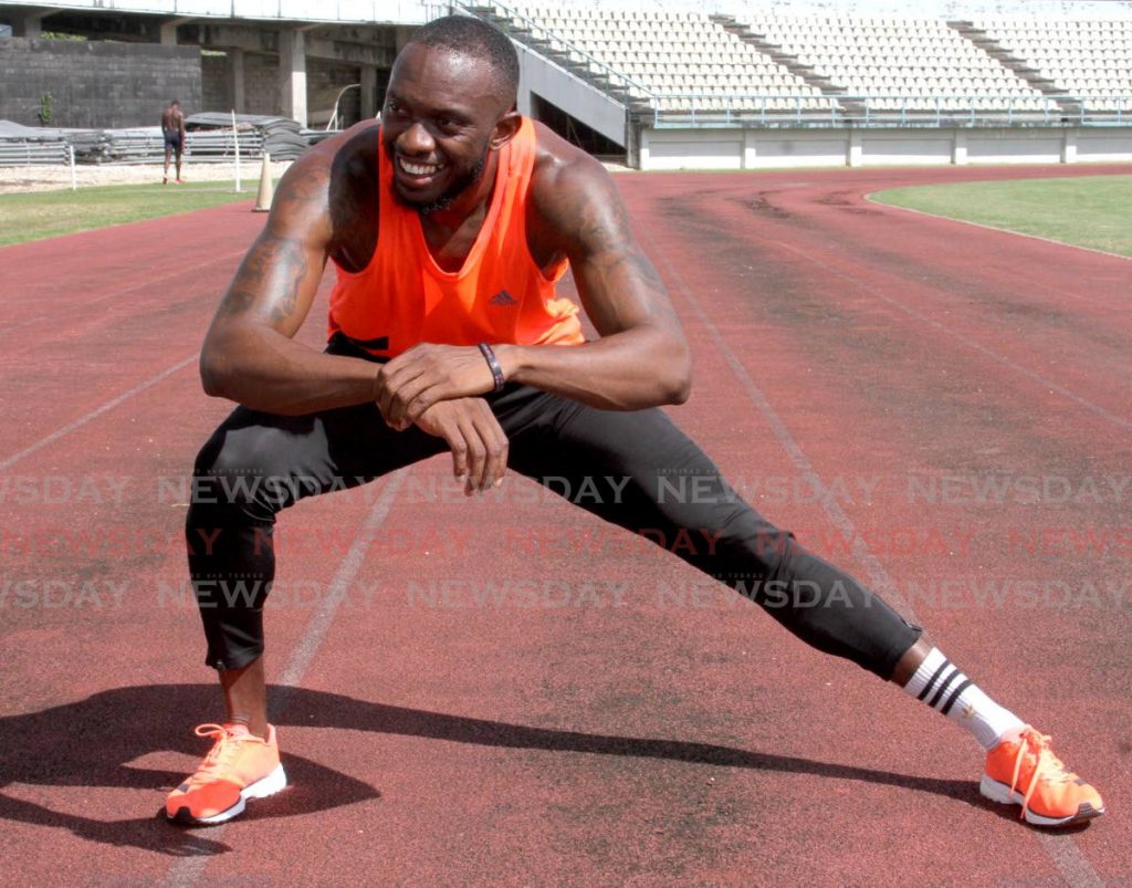 TT sprinter Kyle Greaux stretches during a training session, at the Larry Gomes Stadium, Malabar, on Tuesday. - Angelo Marcelle