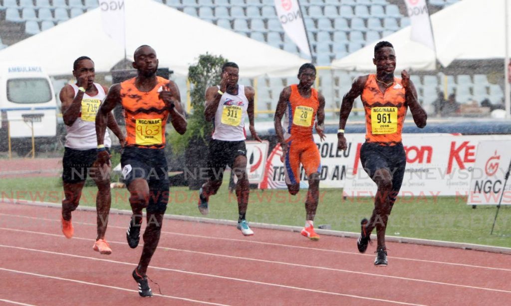 In this June 24, 2018 file photo, Kyle Greaux (second left), outpaces clubmate Jereem Richards (right), to win the Men's 200-metre final, at the NGC/Sagicor/NAAA National Open Championships, held at the Hasely Crawford Stadium, Mucurapo. Photo by Sureash Cholai. - CHOLAI