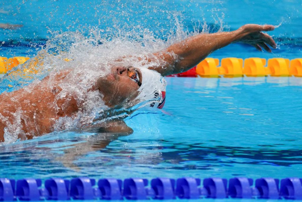 Dylan Carter, of Trinidad and Tobago, swims in a heat during the men's 100-metre backstroke at the 2020 Summer Olympics, on July 25, 2021, in Tokyo, Japan. (AP PHOTO) - AP