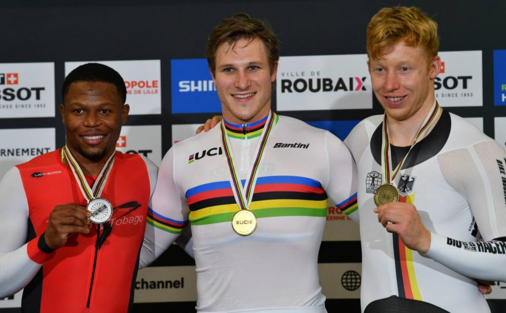 Silver medallist Trinidad and Tobago's Nicholas Paul (left), gold medallist Netherlands' Jeffrey Hoogland (centre) and bronze medallist Germany's Joachim Eilers celebrate on the podium after the men's 1Km Time Trial final during the UCI Track Cycling World Championships at The Jean-Stablinski Velodrome in Roubaix, France, on Friday. (AFP PHOTO)