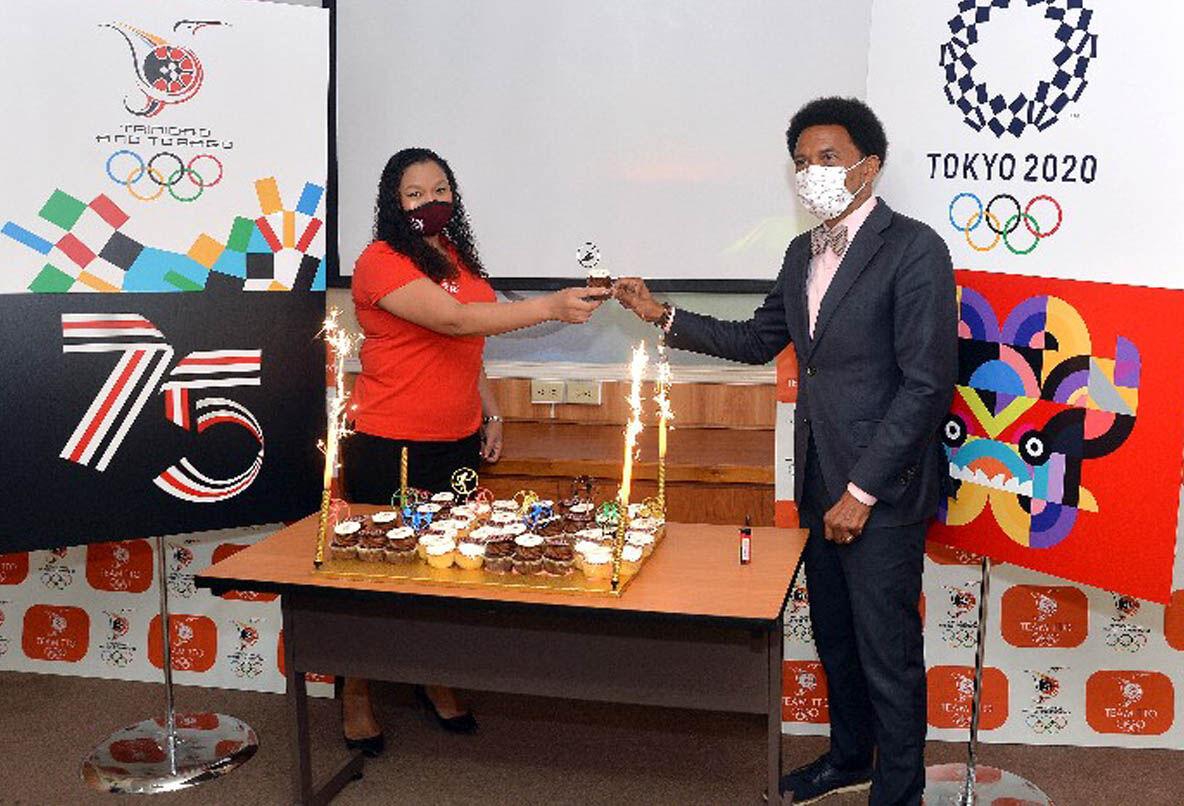 Trinidad and Tobago Olympic Committee (TTOC) president Brian Lewis, right, and Team TTO chef de mission for the July 23 - August 8 Tokyo Olympic Games, Lovie Santana, toast over some commemorative Team TTO cupcakes. —Photo: ROBERT TAYLOR