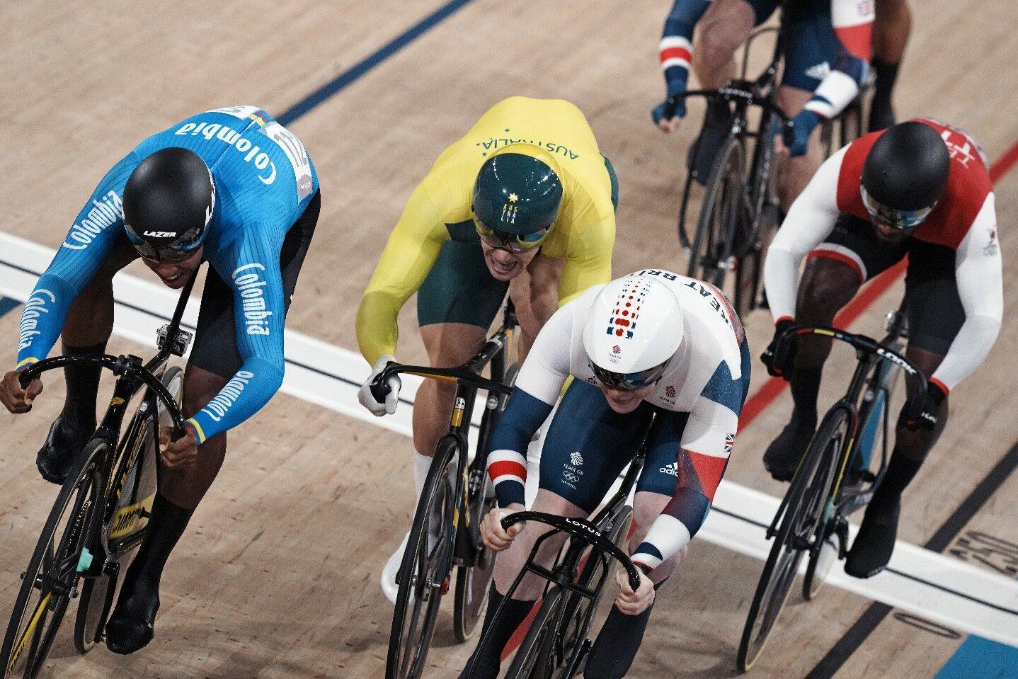 SPRINT ON: Colombia’s Kevin Santiago Quintero, left to right, Australian Matthew Glaetzer, Britain’s Jack Carlin and T&T’s Kwesi Browne compete in a semi-final heat of the Men’s Keirin race, at the 2020 Summer Olympics, in Izu, Japan, yesterday. —Photo: AP