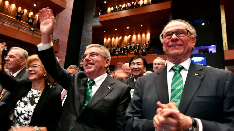 The Associated Press FILE - Then President of the Rio 2016 Olympic Organizing Committee Carlos Arthur Nuzman, right, and International Olympic Committee President Thomas Bach, second right, applaud during the opening ceremony of the 129th International Olympic Committee session, in Rio de Janeiro on August 1, 2016, ahead of the Rio 2016 Olympic Games. Nuzman, the head of the Brazilian Olympic Committee for more than two decades, was sentenced to 30 years and 11 months in jail for allegedly buying votes for Rio de Janeiro to host the 2016 Olympics. The ruling by Judge Marcelo Bretas became public Thursday, Nov. 25, 2021. (Fabrice Coffrini/Pool Photo via AP, File)