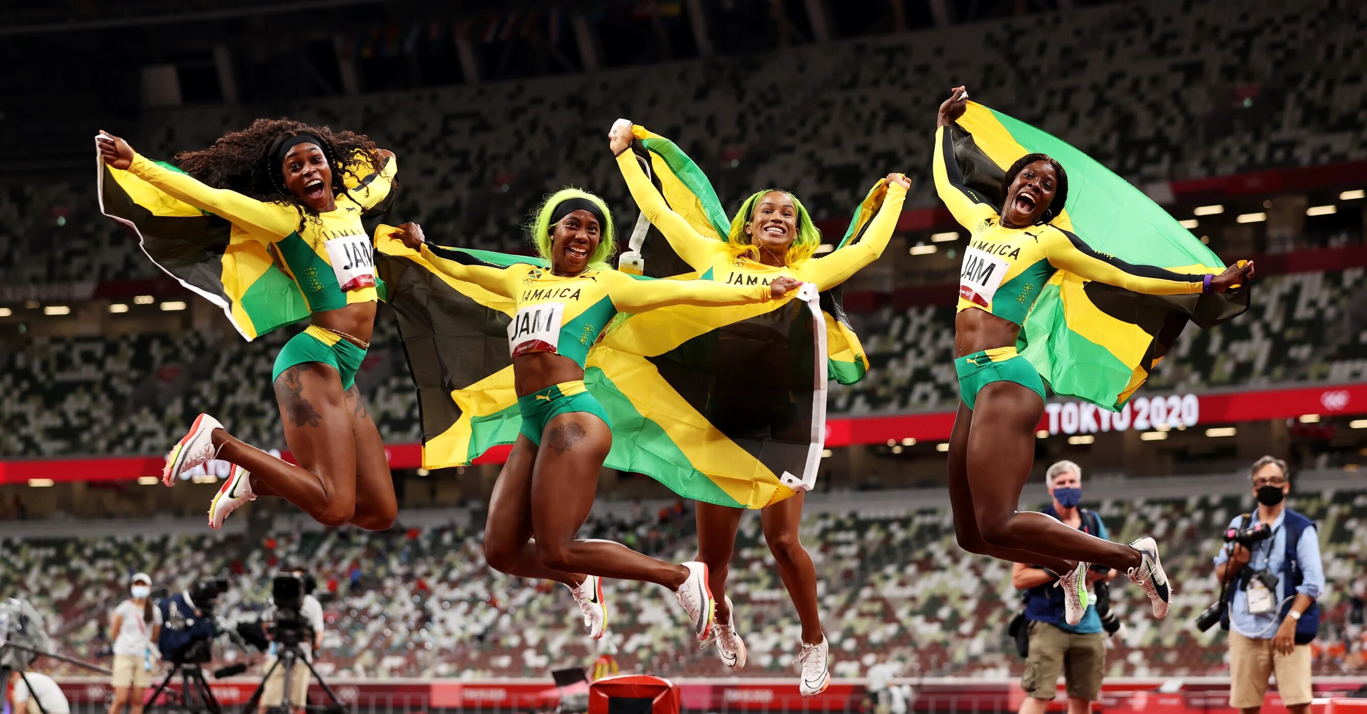 Briana Williams, Elaine Thompson-Herah, Shelly-Ann Fraser-Pryce and Shericka Jackson of Team Jamaica celebrate winning the gold medal in the Women's 4 x 100m Relay Final on day fourteen of the Tokyo 2020 Olympic Games at Olympic Stadium on August 06, 2021 in Tokyo, Japan. (Photo by David Ramos/Getty Images) 2021 Getty Images