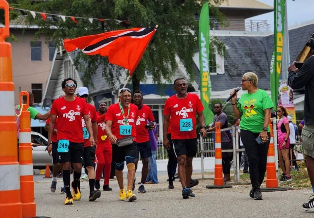 Former TTOC president Brian Lewis during Sunday's marathon walk which started and ended at the Queen's Park Savannah in Port of Spain. - (Image from newsday.co.tt)