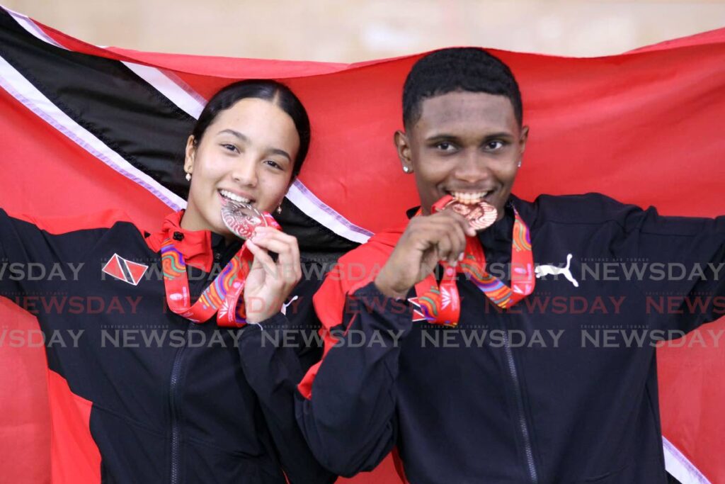 Makaira Wallace, left, and Syndel Samaroo with their Commonwealth Youth Games cycling medals at the National Cycling Velodrome, Couva, Thursday. - Lincoln Holder (Image obtained at newsday.co.tt)