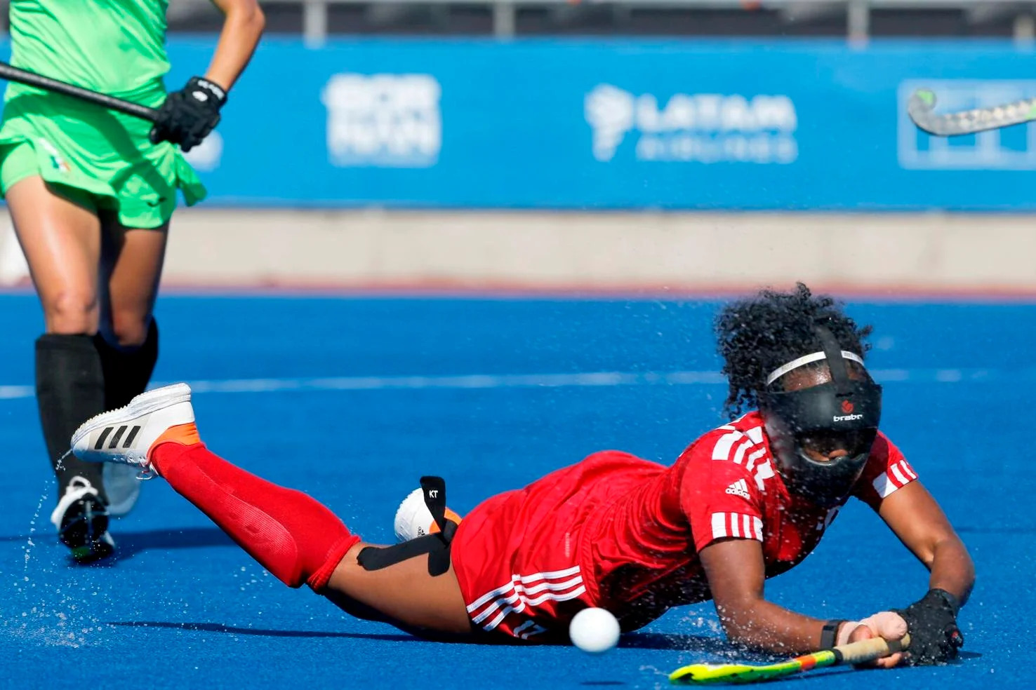 DESPERATE EFFORT: TEAM TTO’s Katherine Benjamin, part of the team’s defensive corner unit, goes to ground to stop a Mexico penalty corner shot during their women’s 7th to 8th place playoff yesterday at the Centro Deportivo de Hockey Césped. TTO showed grit to earn a 1-0 win at the Santiago 2023 Pan American Games.  —Photo: Photosport/ Panam Sports (Image obtained at trinidadexpress.com)