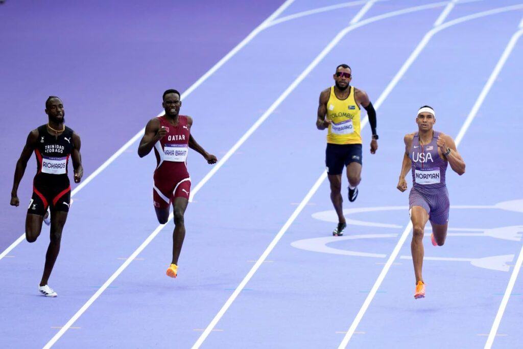 Jereem Richards, of Trinidad And Tobago, from left; Ammar Ismail Yahia Ibrahim, of Qatar; Anthony Jose Zambrano, of Colombia; and Michael Norman, of the US, compete in a men's 400 metres round one heat at the 2024 Olympics. - AP PHOTO (Image obtained at newsday.co.tt)