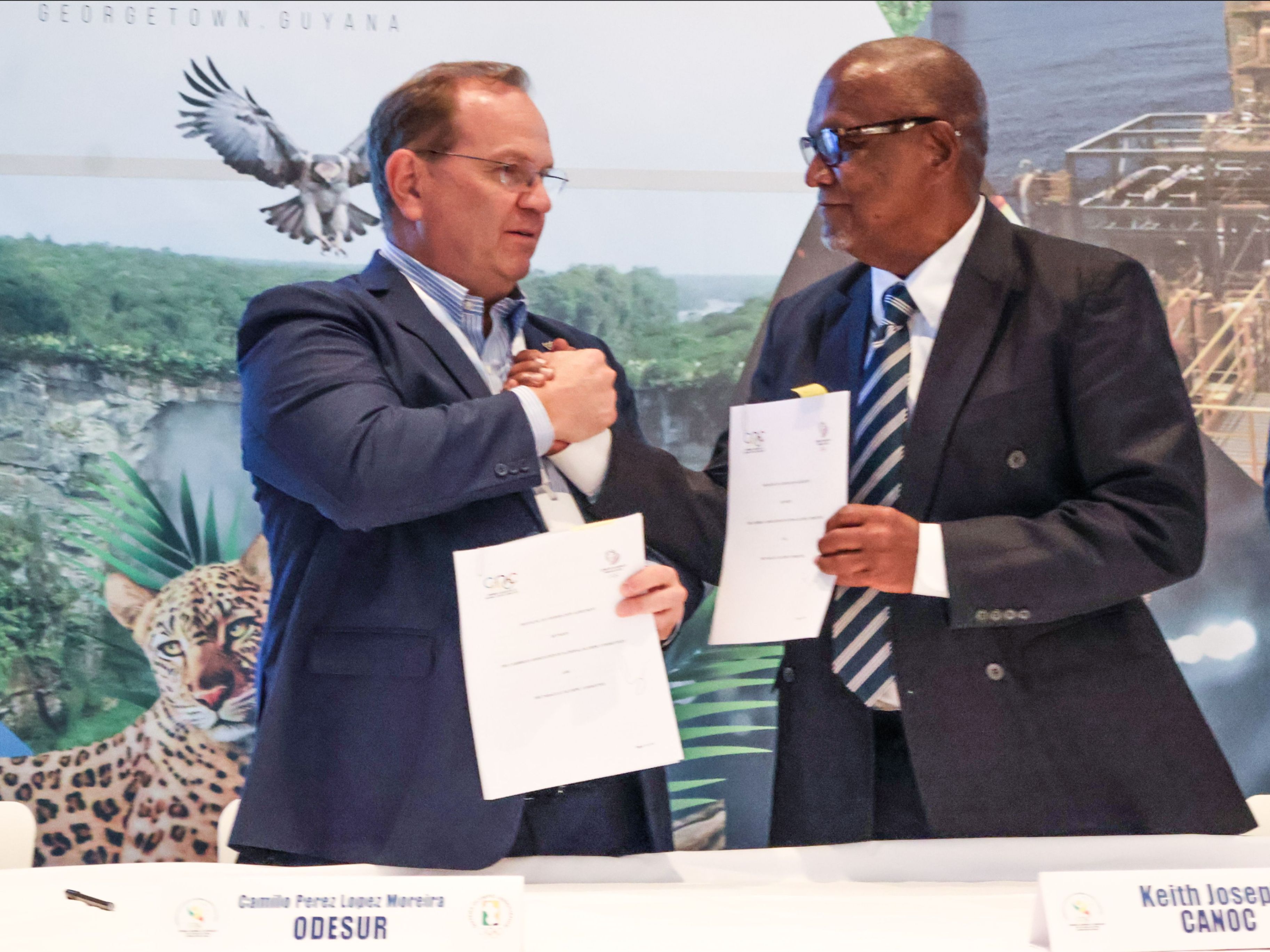 ANOC President Keith Joseph (right) and Camilo Pérez López Moreira, representing the Paraguay Olympic Committee, exchange signed documents following the official signing of a  Memorandum of Understanding to strengthen sport development and cooperation between the Caribbean and South America at the CANOC Annual General Assembly 2025 in Georgetown, Guyana. (Image obtained from CANOC Newsletter)