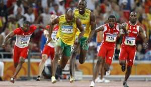 DECISIVE LEG: Trinidad and Tobago’s Richard Thompson, second right, receives the baton from Emmanuel Callendar even as Jamaica’s Usain Bolt, centre right, urges on Asafa Powell who is already into stride, on the final leg of the men’s 4x100-metre relay at the Beijing 2008 Olympics in China on August 22, 2008. Powell crossed the finish line ahead of Thompson but, ten years later, T&T will be given the gold because Jamaica’s first leg runner Nesta Carter was doped. DECISIVE LEG: Trinidad and Tobago’s Richard Thompson, second right, receives the baton from Emmanuel Callendar even as Jamaica’s Usain Bolt, centre right, urges on Asafa Powell who is already into stride, on the final leg of the men’s 4x100-metre relay at the Beijing 2008 Olympics in China on August 22, 2008. Powell crossed the finish line ahead of Thompson but, ten years later, T&T will be given the gold because Jamaica’s first leg runner Nesta Carter was doped.