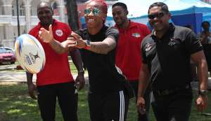 Commonwealth Games 100 metres gold mnedallist T&T’s Michelle-Lee Ahye, centre, tries her hand at rugby during the T&T Olympic Committee’s observance of International Olympic Day at Woodford Square, Port-of-Spain, back in June. CA-images/ Allan Crane Commonwealth Games 100 metres gold mnedallist T&T’s Michelle-Lee Ahye, centre, tries her hand at rugby during the T&T Olympic Committee’s observance of International Olympic Day at Woodford Square, Port-of-Spain, back in June. CA-images/ Allan Crane