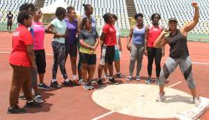 Four-time Olympian Cleopatra Borel,right, demonstrates shot put technique to participants at the Cleopatra Borel Foundation Throws Meet, yesterday, at the Hasely Crawford Stadium,Port of Spain. Four-time Olympian Cleopatra Borel,right, demonstrates shot put technique to participants at the Cleopatra Borel Foundation Throws Meet, yesterday, at the Hasely Crawford Stadium,Port of Spain.